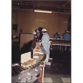 Finger Biscuits. Loaded cartons approaching checkweigher.