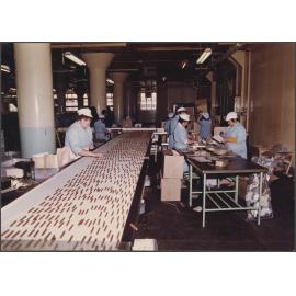 Finger Biscuits. Making up empty cartons in background.