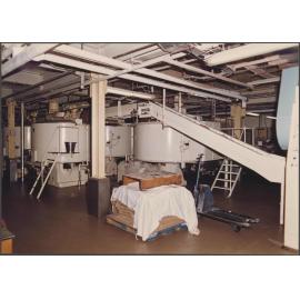 Chocolate making. Steel band from refiners to conches.