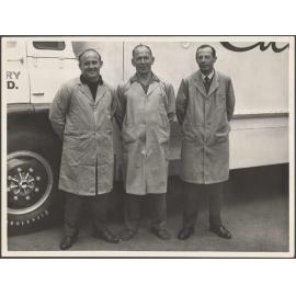 Three men standing in front of a Cadbury Fry Hudson truck