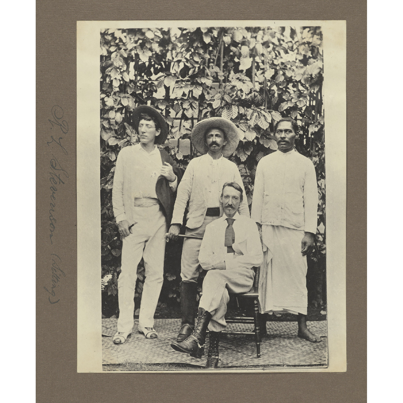 R.L. Stevenson (sitting)