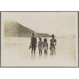 Charles and Lesley Brasch and three unidentified children standing in a lake