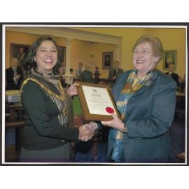 Presentation to Sukhi Turner by Dame Elizabeth Hanan on behalf of the Dunedin City Council