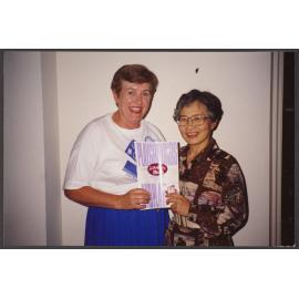 Elizabeth Hanan and unidentified woman with Japanese translation of Hanan's book 'Playgrounds and Play'