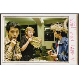 Postcard with photograph showing Elizabeth Hanan playing a bamboo flute