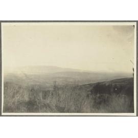 Grassy hills overlooking plain