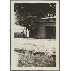Two unidentified women standing outside Arms [? Hotel]