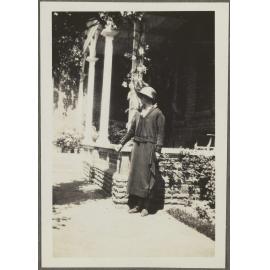 Unidentified woman by porch