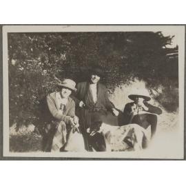 Two unidentified people and [Lesley Brasch] with dog