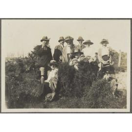 Group of people among shrubs