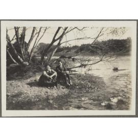 Charles and Lesley Brasch sitting beside a river