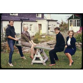 Christopher [?], Mrs Mackintosh, Julian, and Alison, on a see-saw