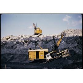 Open cast coal mine. 'Returning the surplus load'.