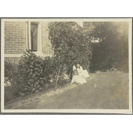 Lesley Brasch and [Elespie Forsyth] sitting by garden