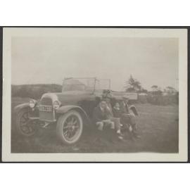 Charles, Lesley and Henry Brasch and unidentified women sitting on a car
