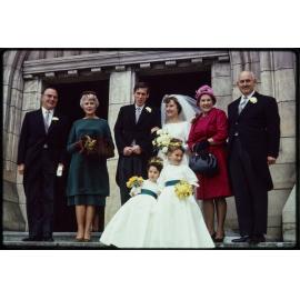 Jennifer and Barry Scott on their wedding day, with their parents, and flower girls