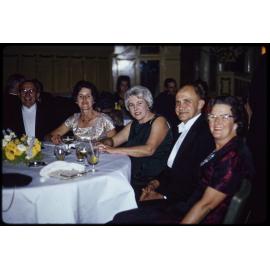 Group at wedding reception, including Sir John and Lady Enid Walsh
