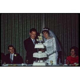 Leslie and Patricia Holborow cutting their wedding cake