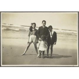 Charles and Lesley Brasch on the beach with two unidentified children