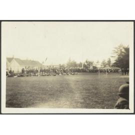 Large congregation on grass field