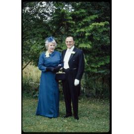 Lady Enid and Sir John Walsh, dressed for their daughter Elizabeth's wedding