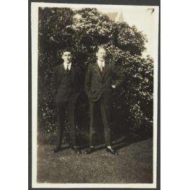 Two unidentified young men in suits