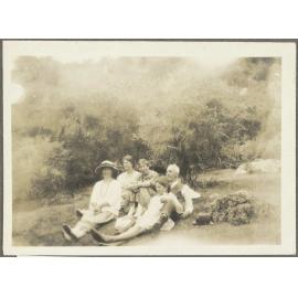 Henry and Lesley Brasch, Jane McCartney and two unidentified women sitting on grass