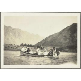 Ten unidentified people in a row boat