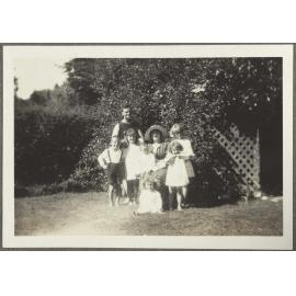 Unidentified woman, man and six children