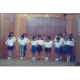 Cambodian children performing at Brockville School with their teacher Maly Chum in the background