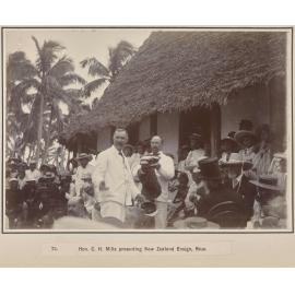 Hon. C.H. Mills presenting New Zealand Ensign, Niue