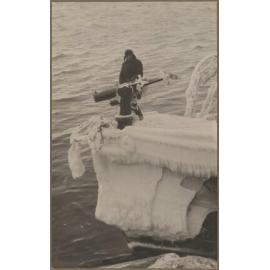 Man standing on gun platform