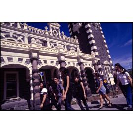 People walking in front of Dunedin Railway Station