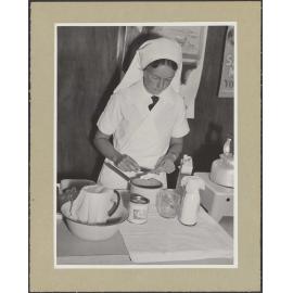 Nurse preparing baby formula [?]