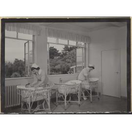 Nurses with babies in bassinets