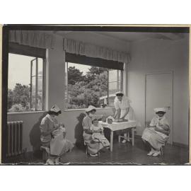Nurses feeding babies