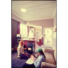 Students in kitchen and living area