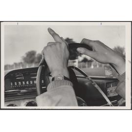 Hands on a steering wheel