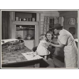 'Baby receiving immunization injection in the home'