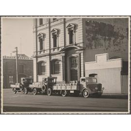 Three delivery trucks outside Thomsons premises