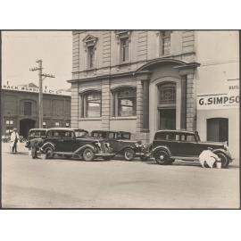 Taxis being washed outside Thomsons premises