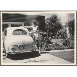 Brenda Slade cleaning Austin A30 car