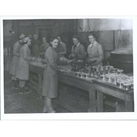 Packing sheep tongues into tins