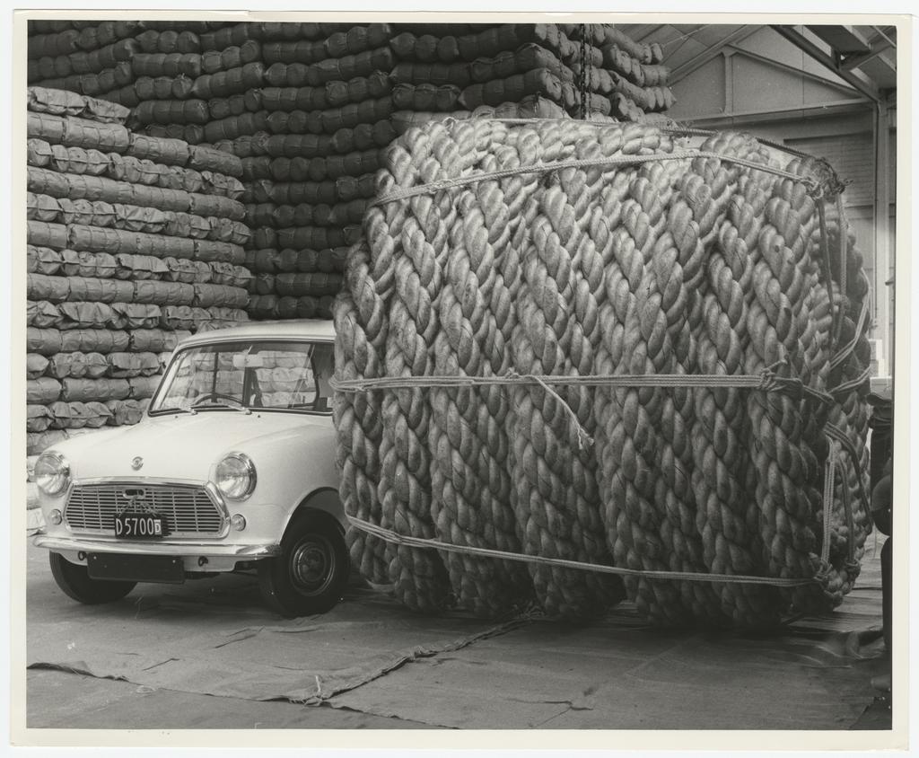 Large roll of rope next to Mini car