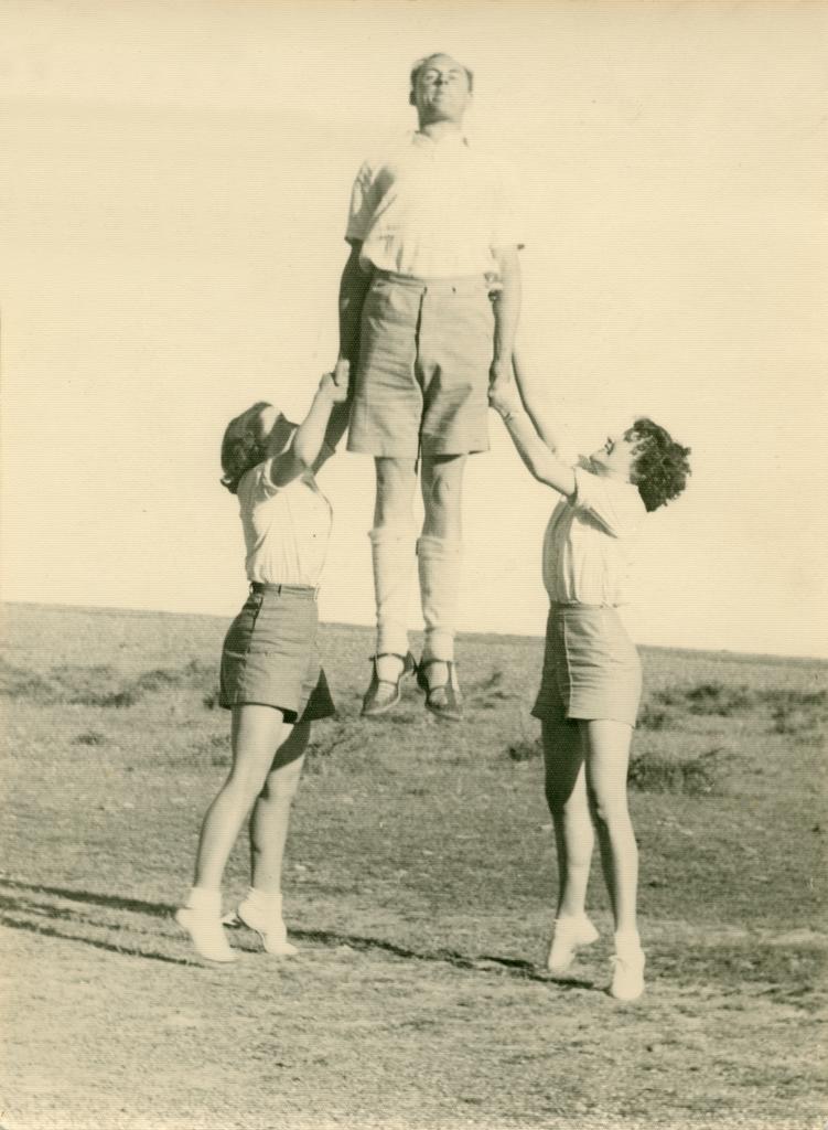 Philip Smithells and two women in outdoor gymnastic demonstration