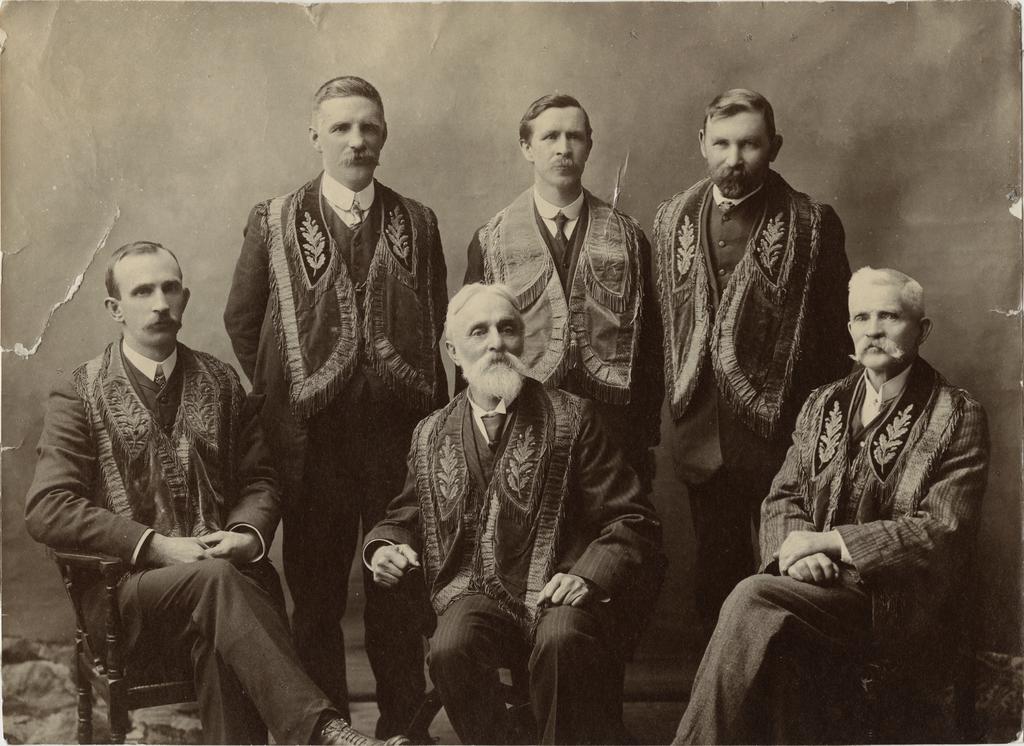 Six men wearing regalia