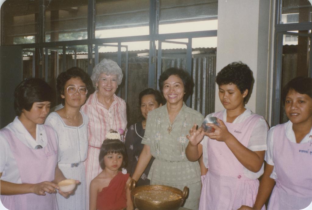 Professor Patricia Coleman with Asian women and children
