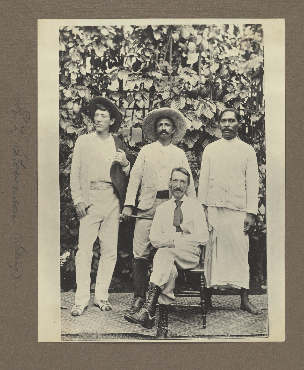 R.L. Stevenson (sitting)